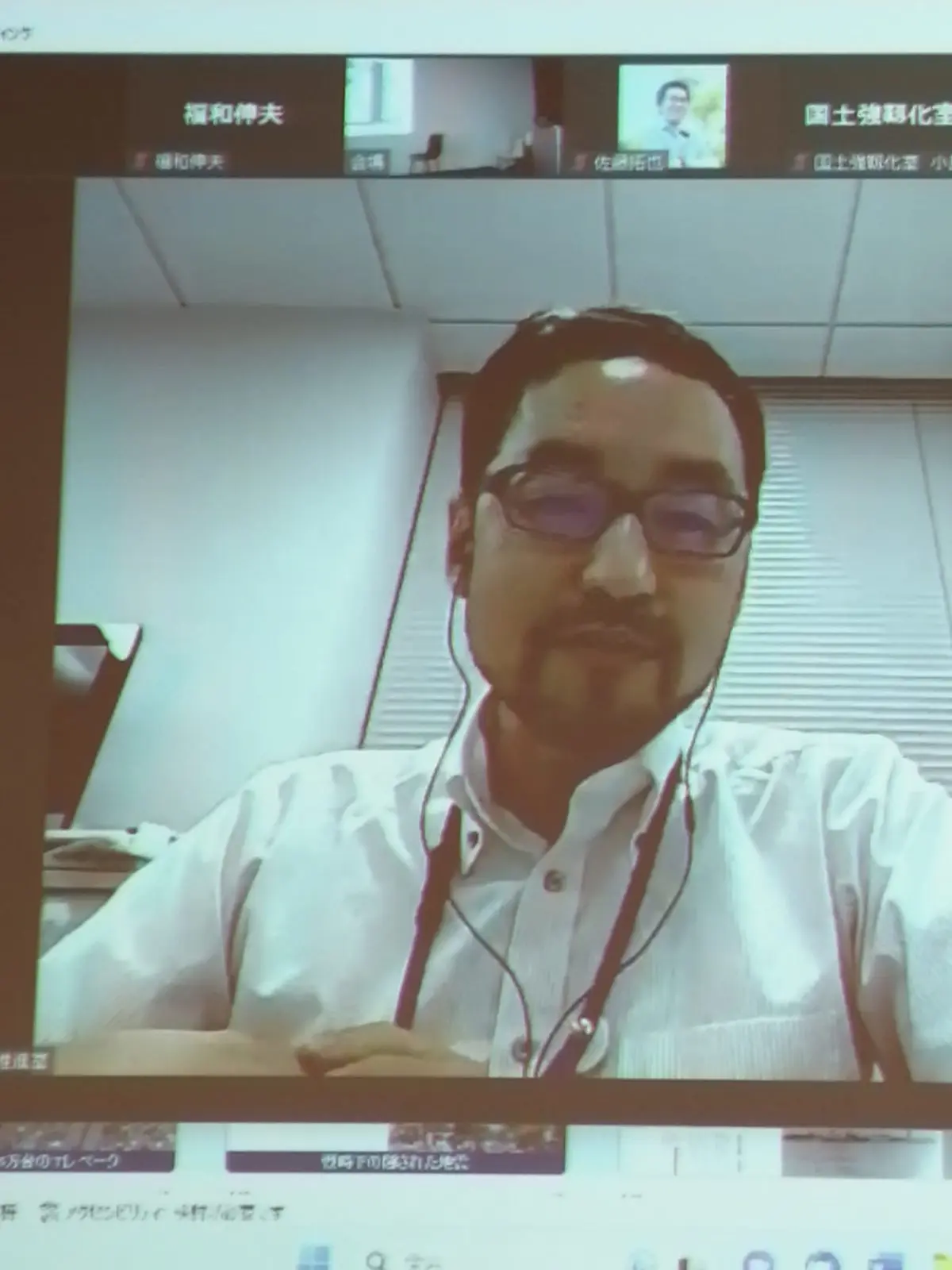 内閣官房国土強靱化推進室 村川奏支参事官がリモートで挨拶している様子。